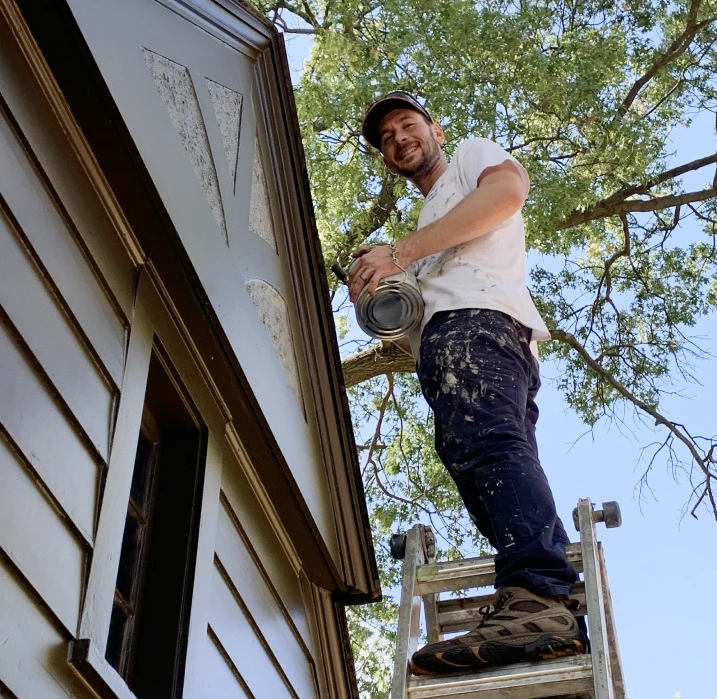 Owner and homeowner inspecting finished paintwork together
