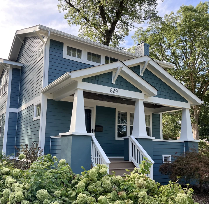 Peeling exterior paint on siding after Michigan freeze-thaw winters